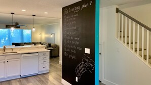 A modern kitchen with a blackboard listing relaxation activities. - Enjoy your beach vacation in this beautifully updated gold rated townhouse!   (Saint Augustine)