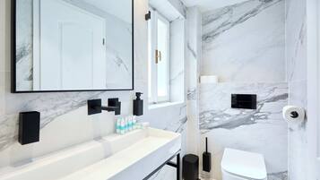 Comfort Apartment | Bathroom | Hair dryer, towels, soap, toilet paper