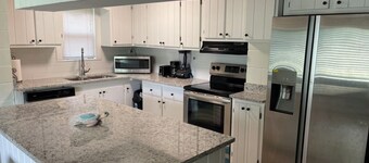 Peaceful Riverfront Cottage with a dock on 1.5 Acres.