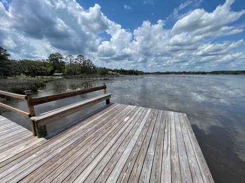 Peaceful Riverfront Cottage with a dock on 1.5 Acres.