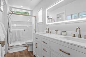 Shower, hair dryer, towels, soap