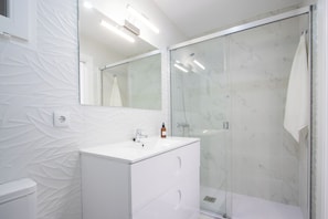 Shower, hair dryer, towels, soap