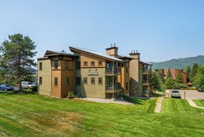 Stunning mountain views surround this building, set amidst well-manicured lawns.