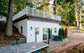 Embrace the tranquility of waterfront living! This beautiful house with a deck offers the ultimate retreat. 