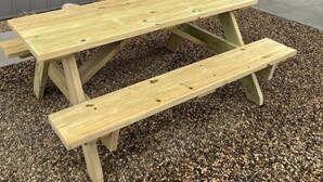 A picnic table with benches outside a building with a 'Suite 2' sign. - Newly built in Devils Lake, Perfect for Fishing or Relaxing.   (Devils Lake)
