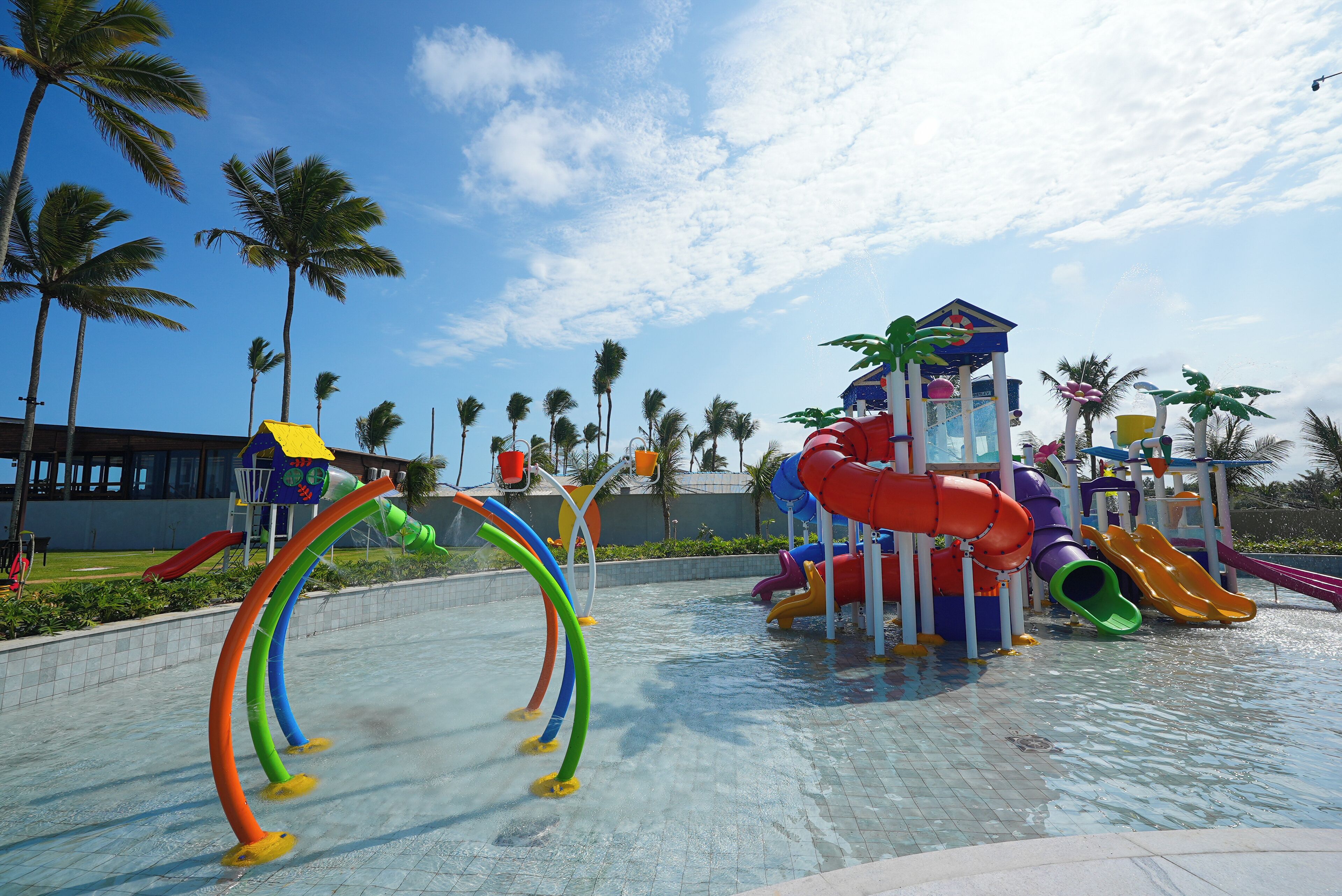 A water park with multiple slides and a pool area.