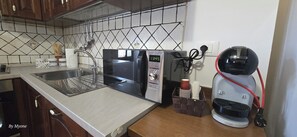 Bloc d'apartaments familiar | Zona per cuinar compartida | Bullidora elèctrica 