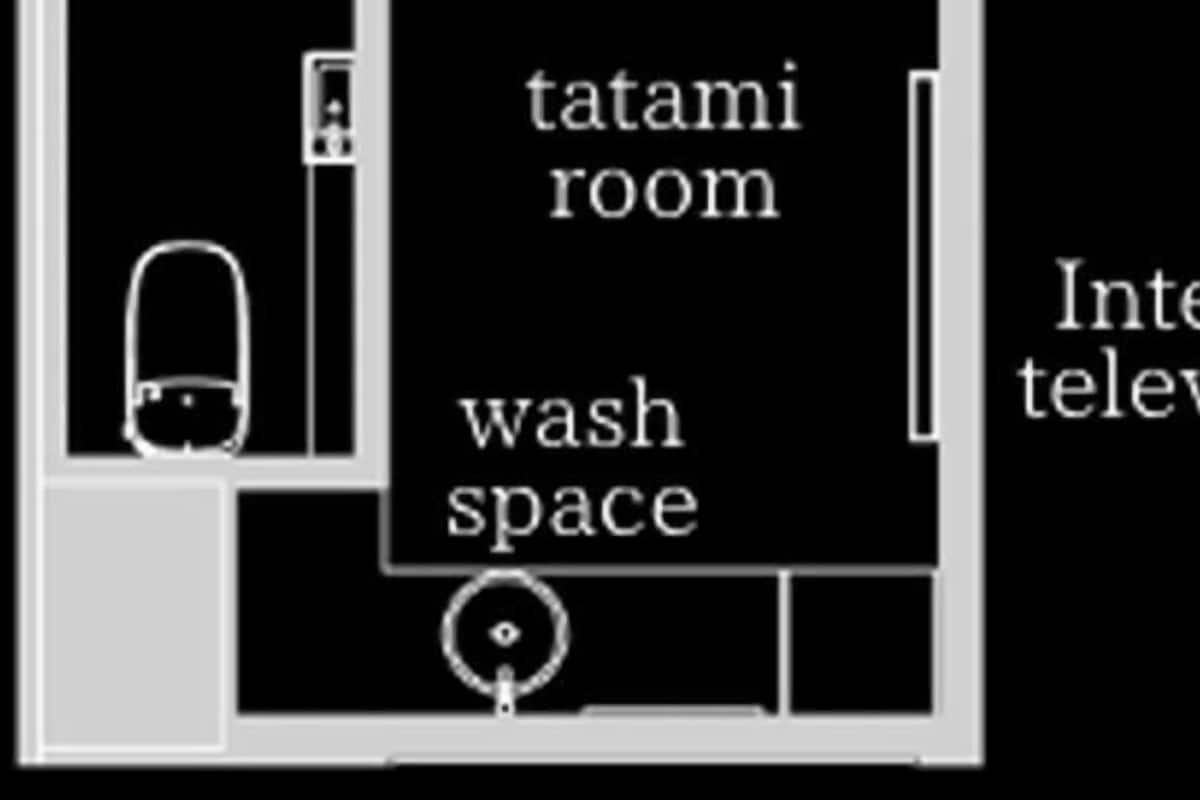 Plano de planta que muestra una habitación con tatamis, zona de lavado y sauna.