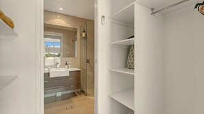 Shower, hair dryer, towels, toilet paper