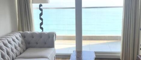Family Apartment, Balcony, Partial Sea View | Living area | Flat-screen TV