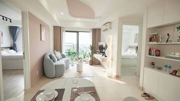 Deluxe Apartment, 2 Bedrooms, Kitchen, City View | Living area | 32-inch Smart TV with satellite channels