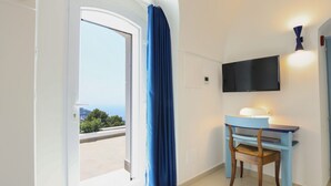 A room with a desk, chair, and a television mounted on the wall. - MyExclusiveItaly - Elegant Villa in Anacapri | Infinity Pool & Design (Anacapri)