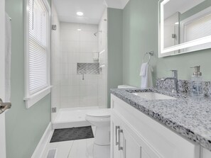 Shower, hair dryer, towels, soap