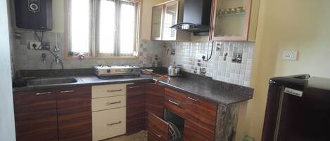 Fridge, stovetop, electric kettle, toaster