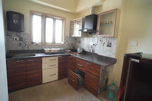 Fridge, stovetop, electric kettle, toaster