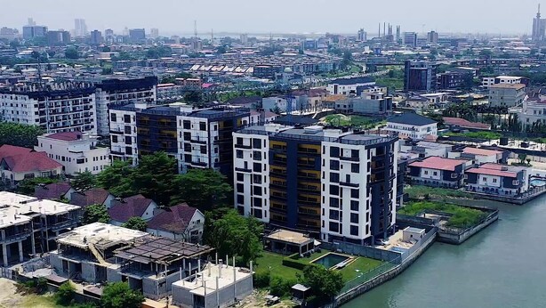 A high-rise residential building with multiple balconies and a riverfront view. - Luxury 3 bedroom, Secure, Water View, 24/7 Power in secluded estate - Ikoyi  (Lagos)