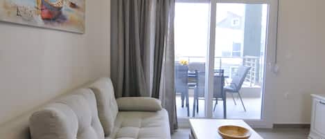 Family Apartment, 2 Bedrooms | Living area | Flat-screen TV