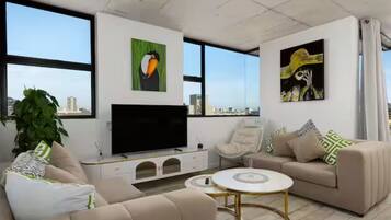 Apartamento, 2 habitaciones | Zona de estar | Una impresora