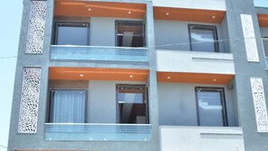 A multi-story building with a reception area, balconies, and a visible entrance. - Girdhar Sanwaria Palace (Danta Ramgarh)