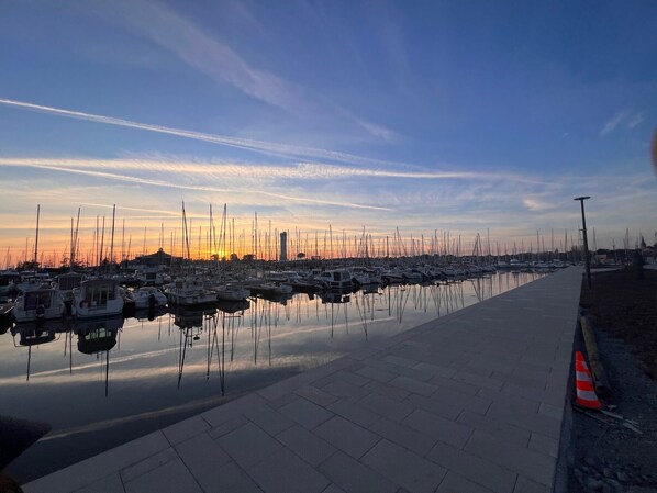 Stunning marina with calm waters and a paved walkway.