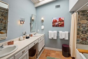 Shower, hair dryer, towels, shampoo