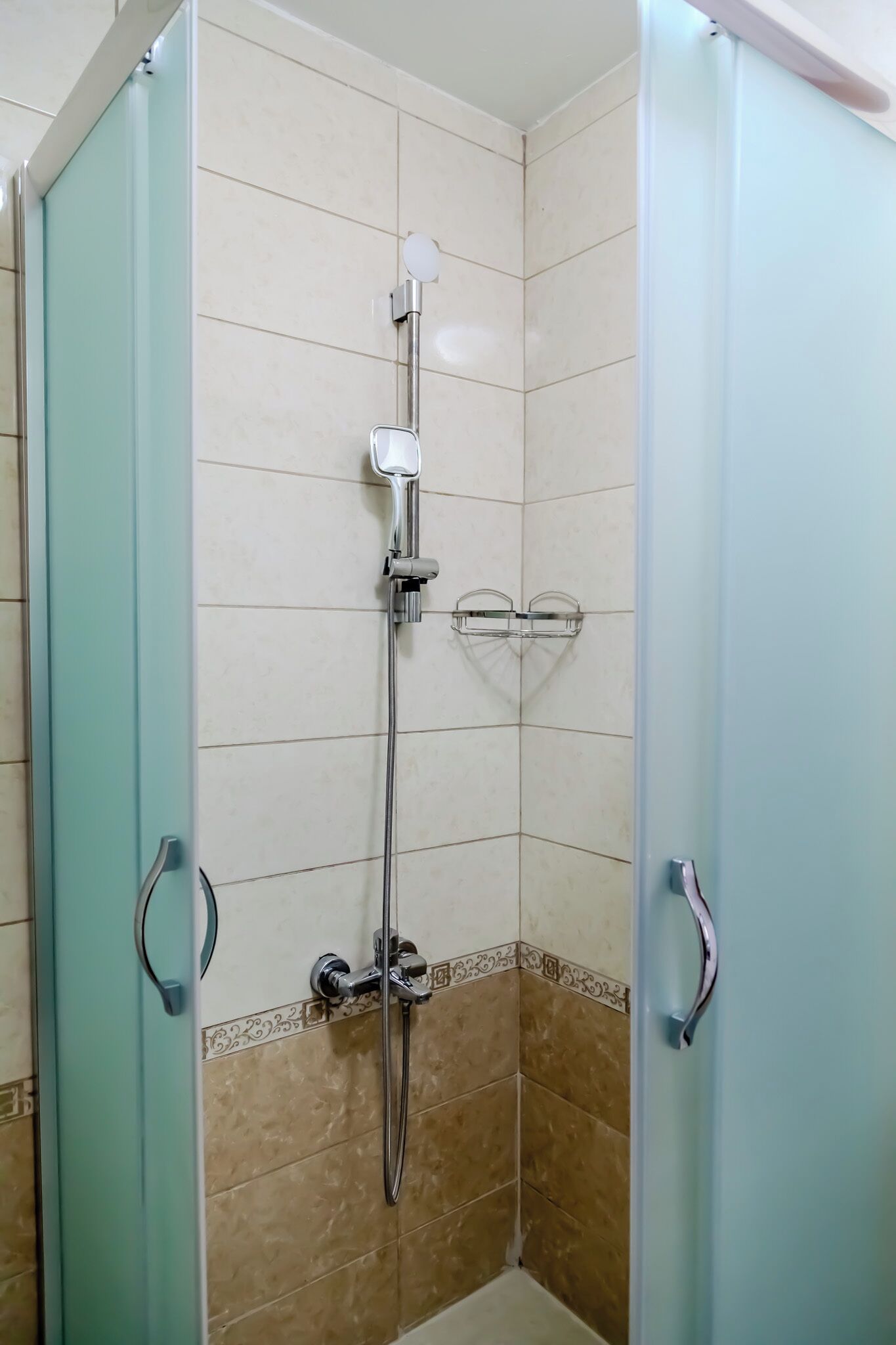 Shower, hair dryer, slippers, towels