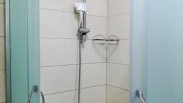 Shower, hair dryer, slippers, towels