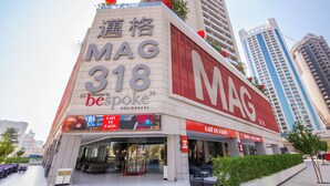 A building with signage for 'MAG 318' and 'bespoke residences'.