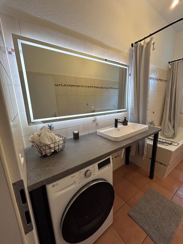 Hair dryer, towels, soap, shampoo