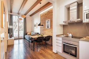 Standard Apartment | Living area | 40-inch flat-screen TV with satellite channels - Aspasios Market Balconies (Barcelona)