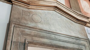 A building facade with a prominent "PORTER" sign, classical architectural elements, and a large entrance doorway. - Adventure Hostel Madrid Gran vía (Madrid)