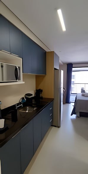 Apartment | Private kitchen | Fridge, microwave, stovetop, cookware/dishes/utensils