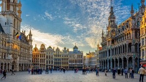 A historic square with ornate buildings, cobblestone pavement, and flags. - greet Brussels Airport Zaventem (Zaventem)