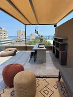 Outdoor pool, open 7:00 AM to 9:00 PM, pool loungers