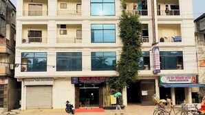 A multi-story hotel with balconies, large windows, and a sign for 'Hotel Stay Inn'. - Hotel Stay Inn Dhaka (Dhaka)