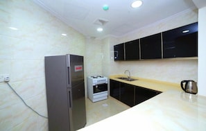 Standard Double Room | Private kitchen | Fridge, microwave, oven, stovetop