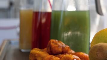 A tray with food and drinks, including a pitcher and bottles.