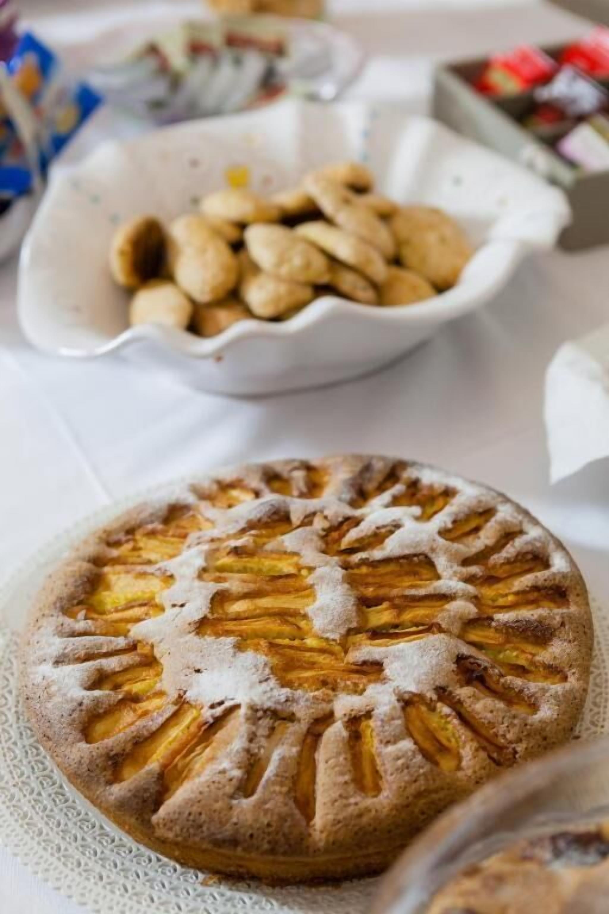 A round cake with a lattice top, placed on a white plate.