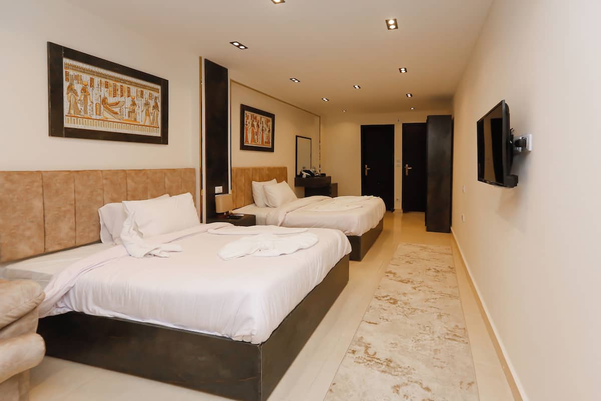 Premium bedding, memory-foam beds, minibar, desk