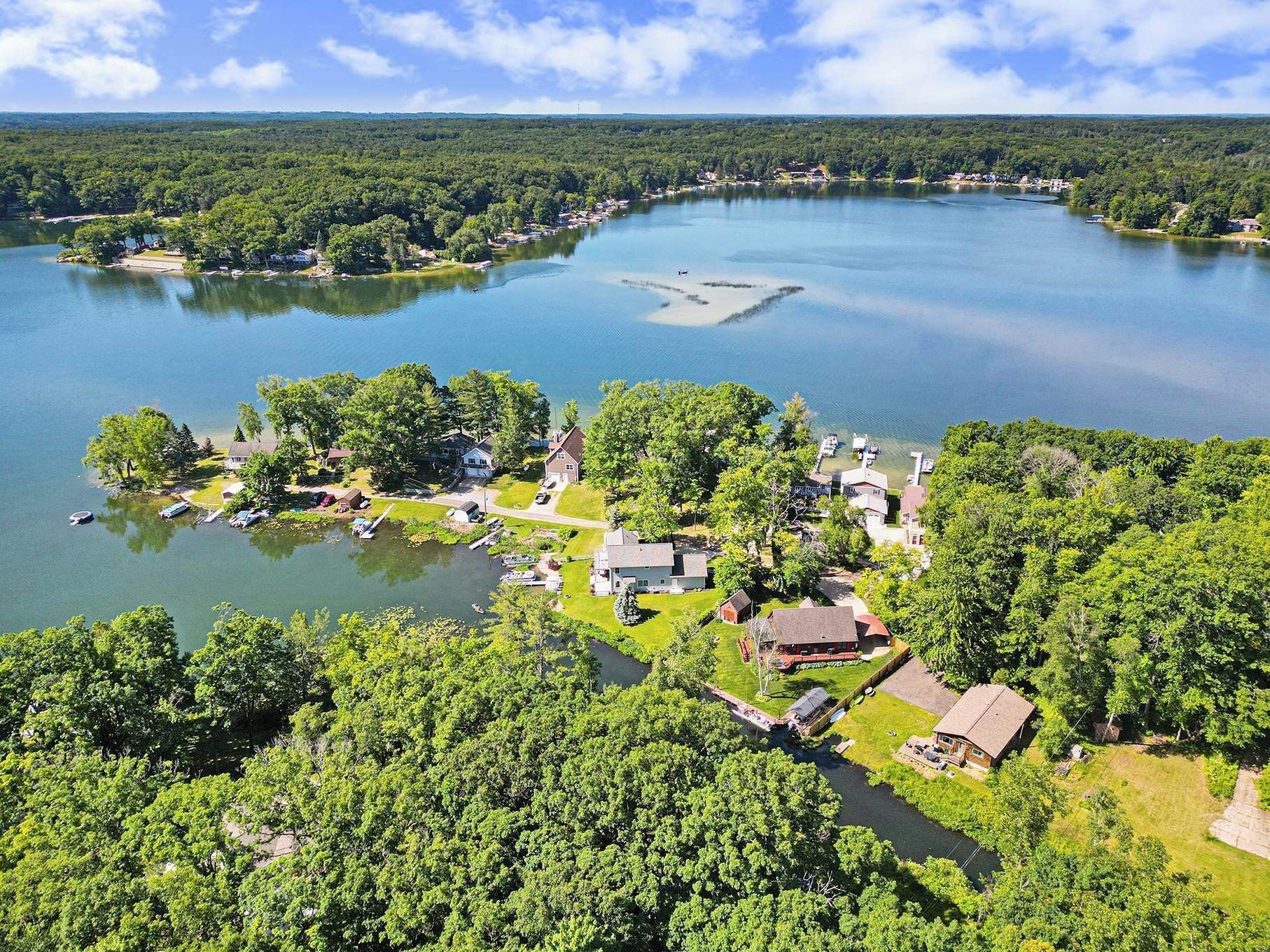 A lakeside community with houses and docks.