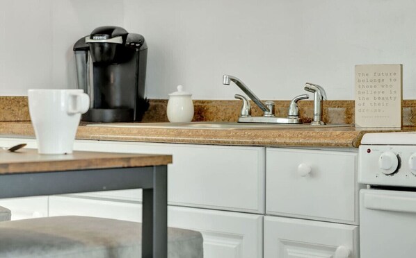 Fridge, microwave, stovetop, coffee/tea maker