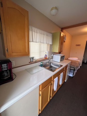 Fridge, microwave, coffee/tea maker, toaster