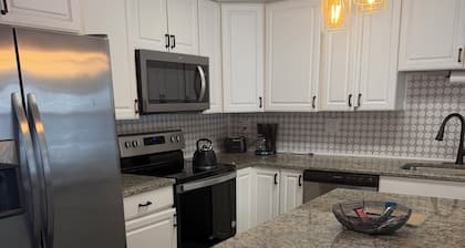 Cozy Ranch Style home with sun porch, above ground pool with fenced yard