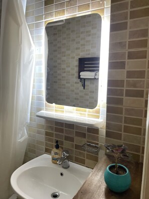 Shower, towels, soap, toilet paper