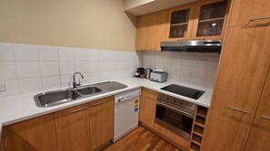 Fridge, microwave, cookware/dishes/utensils, dining tables