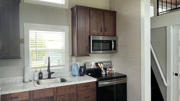 Fridge, microwave, stovetop, coffee/tea maker