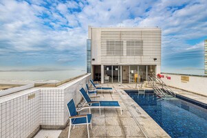 Outdoor pool, pool umbrellas, sun loungers