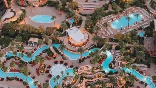 A resort with multiple swimming pools, palm trees, and sun loungers. - Renovated Luxury Studio Suite in Tower 3, New Luxury Suite Tower 3 (Paradise)