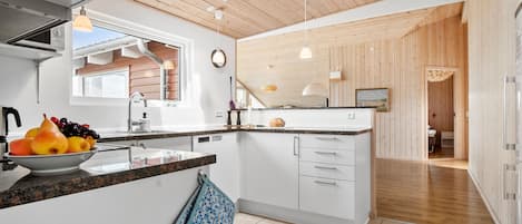 Fridge, stovetop, dishwasher, coffee/tea maker