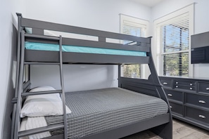 A bunk bed with a lower bunk, a dresser with drawers, and a window with blinds. - SEA-REST!! Relaxed 4br 4ba home, POOL and close to the BEACH! (Alys Beach)